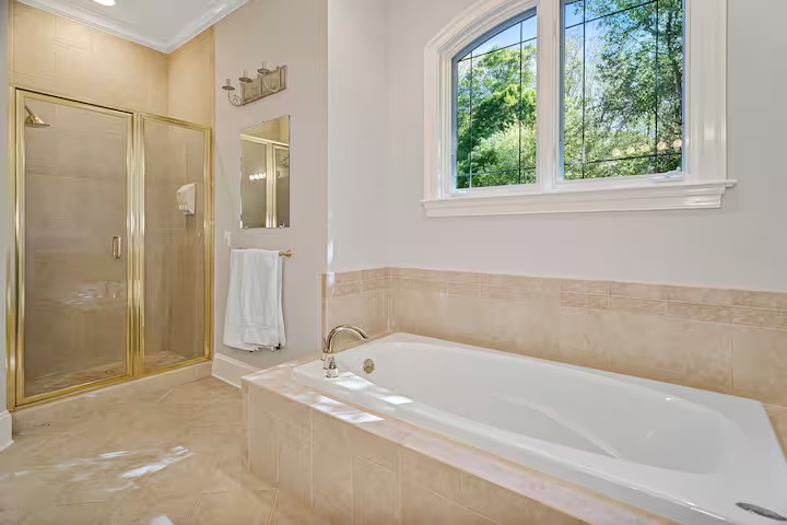 Guest bath with soaking tub and glass shower